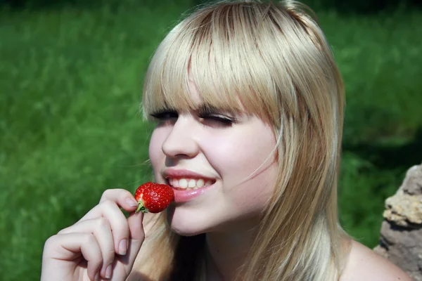 Blonde with berry — Stock Photo, Image