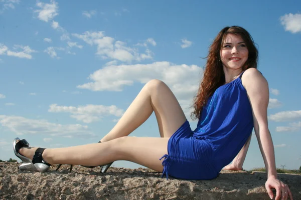 Beautiful smiling girl in blue dress — Stock Photo, Image