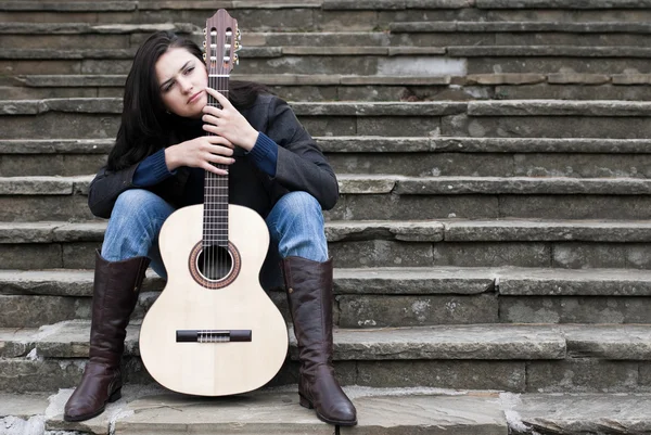 stock image Young female guitarist