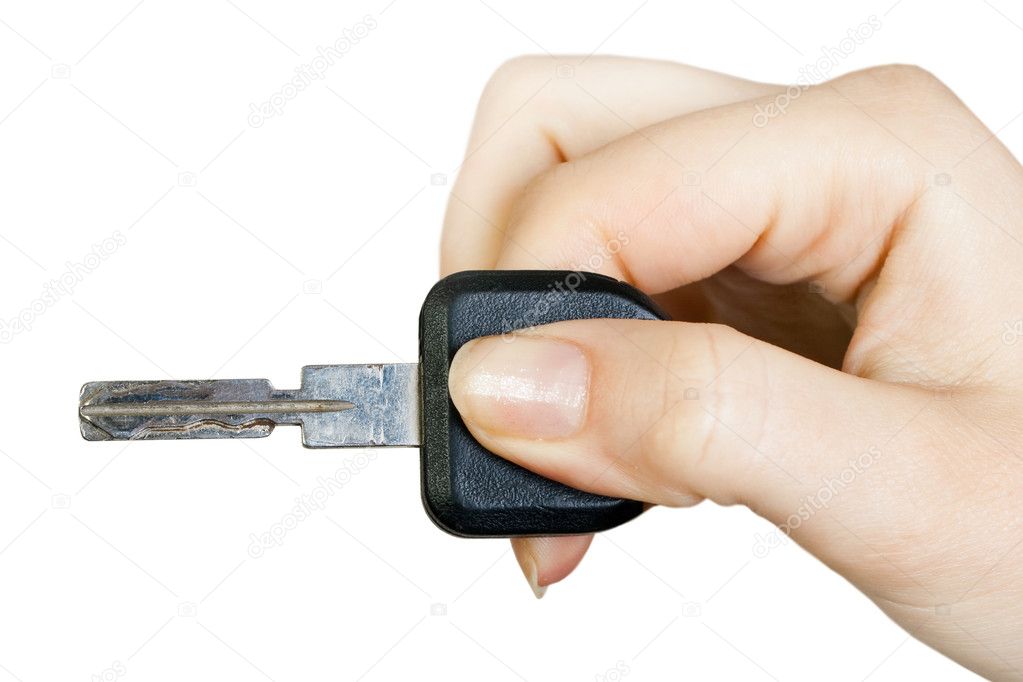 Hand holding key isolated on the white