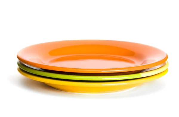 Orangefarbene und grüne Teller — Stockfoto
