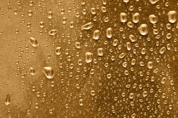 Arany vízcseppek háttér — Stock Fotó