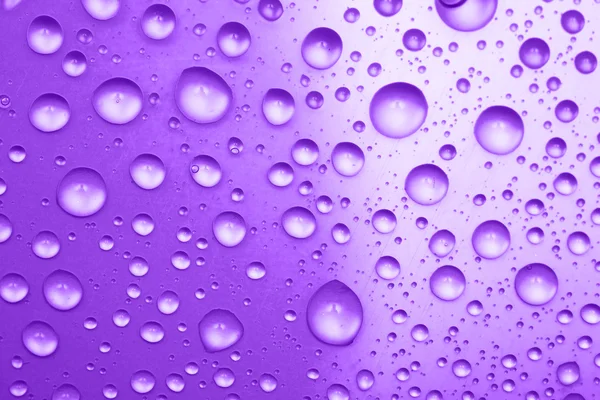 Gotas de agua violeta para el fondo — Foto de Stock