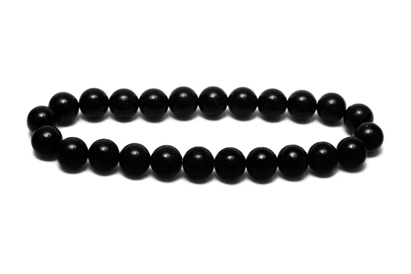 Perline nere isolate su bianco — Foto Stock