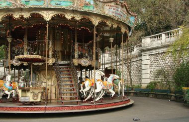 French old carousel with horses clipart