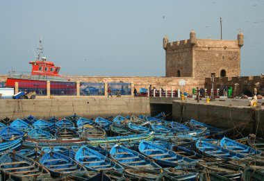 Traditional blue boats in the port clipart