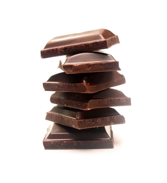 Pilha de peças de chocolate escuro — Fotografia de Stock