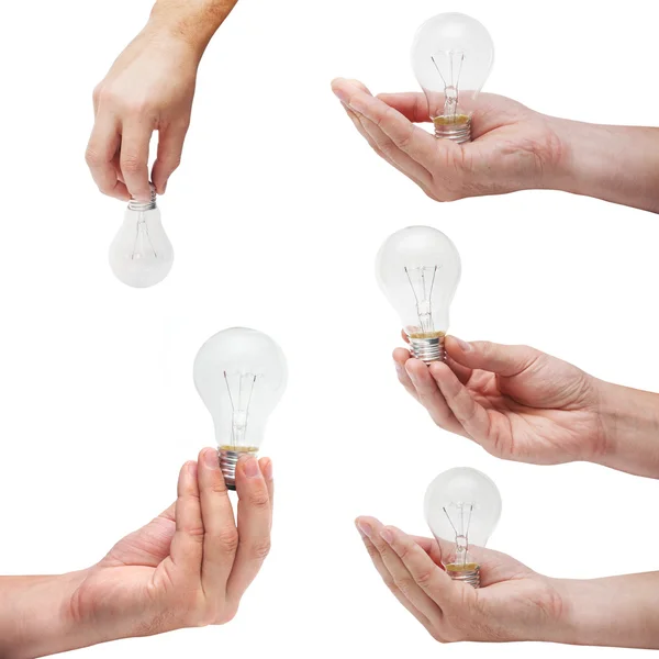 Conjunto de lâmpadas de energia em mãos humanas — Fotografia de Stock
