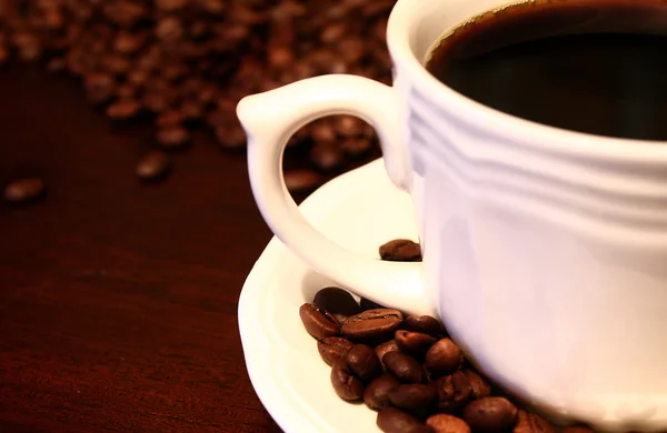 Kaffe och kaffebönor Stockbild