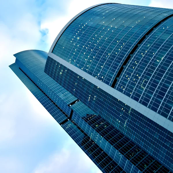Illuminated business skyscrapers — Stock Photo, Image
