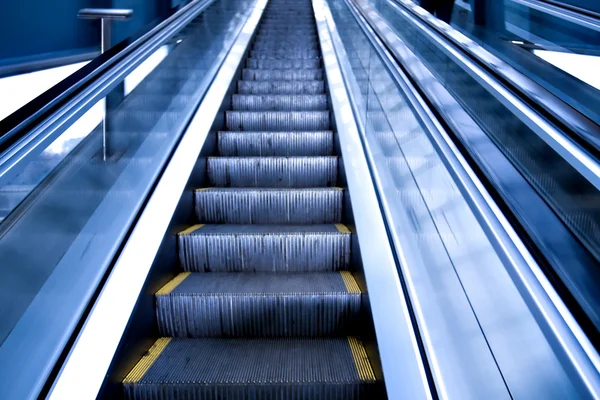 Escalator by motion in business hall — Stock Photo, Image
