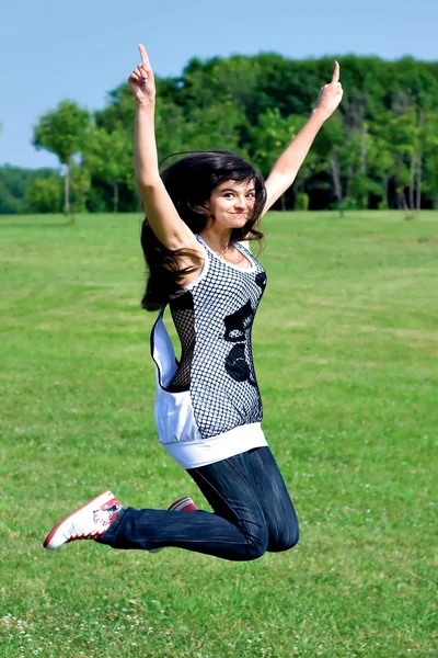 Smile teen open hands jumping — Stock Photo, Image