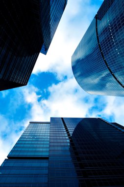 Business skyscrapers vanishing in clouds clipart