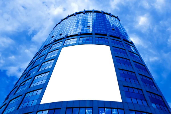 Modern skyscraper with white placard — Stock Photo, Image