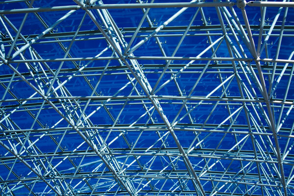 Abstract blue geometric ceiling in office center