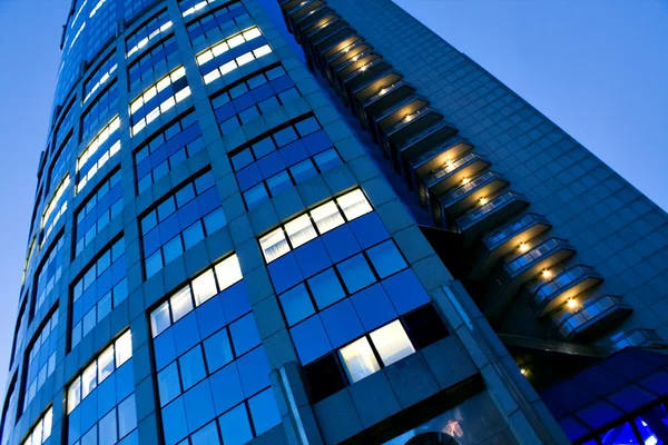 Fragment of illuminated business tower — Stock Photo, Image