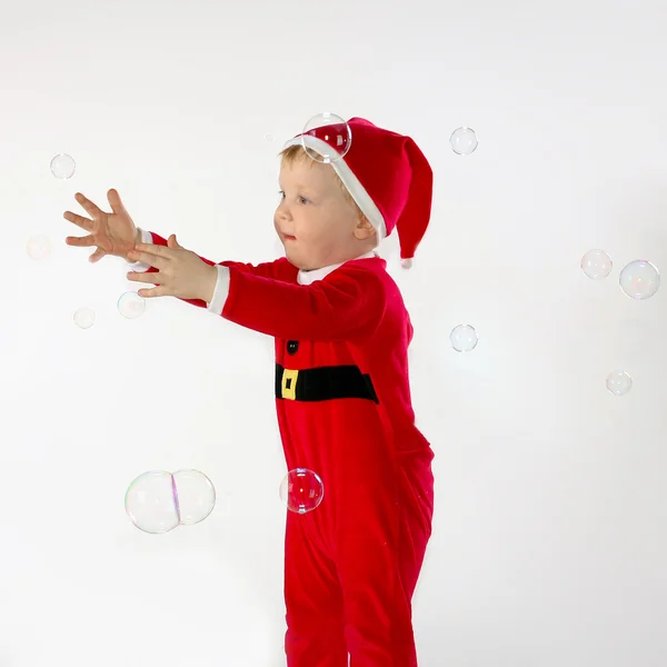 Little boy trying to catch some soap — Stock Photo, Image