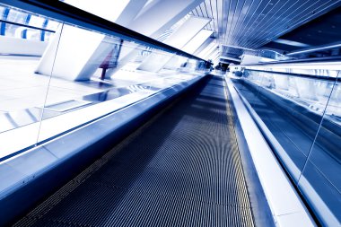 Fast moving escalator by motion clipart