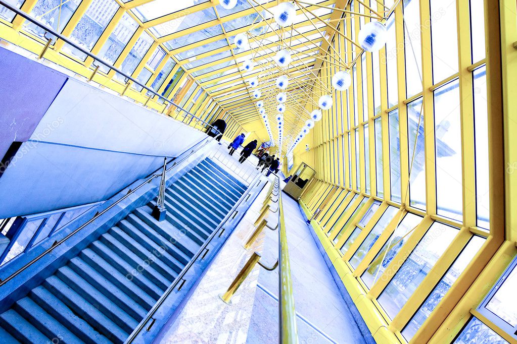 Staircase and yellow glass corridor