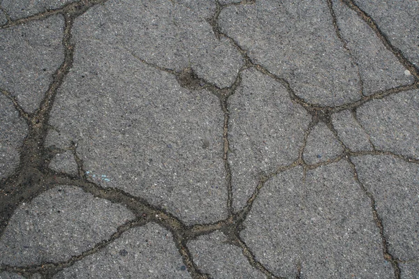 Popraskaný asfalt. — Stock fotografie