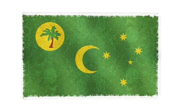 A háttérben a kókusz-sziget zászlaja — Stock Fotó