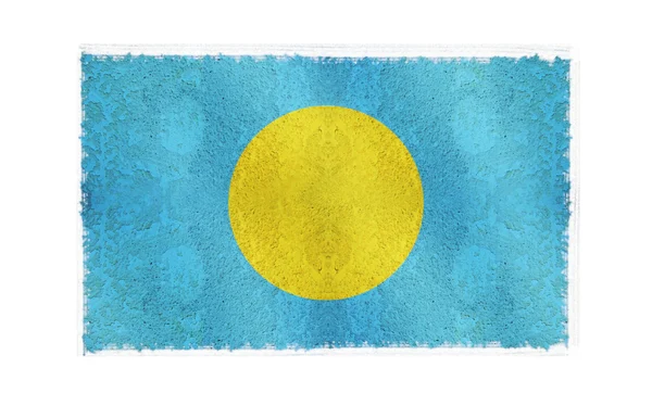 Флаг острова Палау на заднем плане — стоковое фото