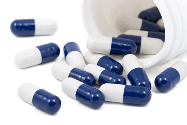 Pilules capsules bleues et blanches — Photo