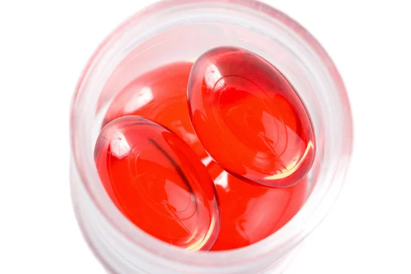 Rode capsule pillen geïsoleerd — Stockfoto