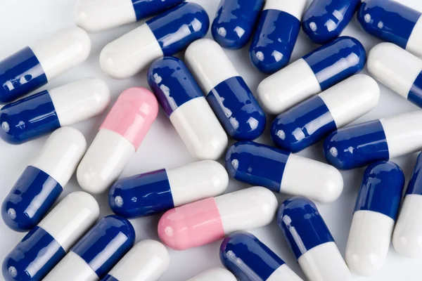 Blue and pink capsule pills — Stock Photo, Image