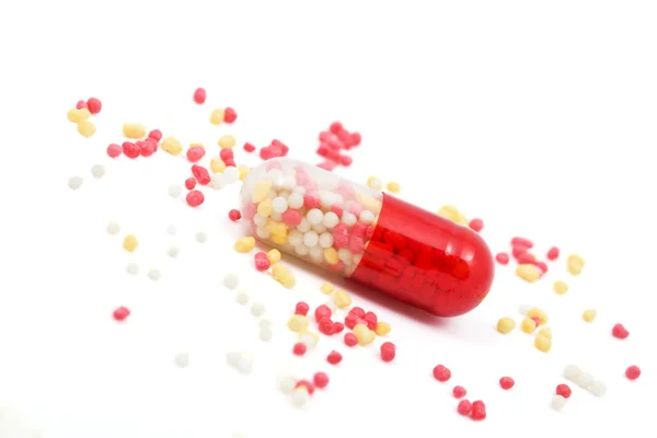 Červené a bílé tobolka pill izolované — Stock fotografie