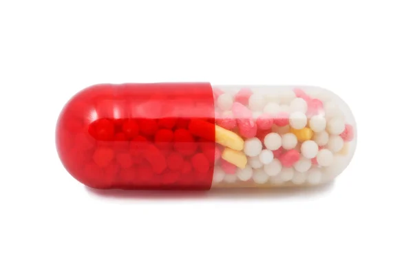 Rød og hvid kapsel pille isoleret - Stock-foto