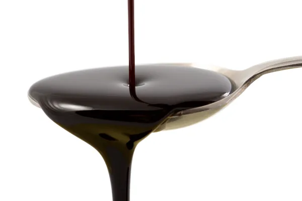 Pouring chocolate syrup — Stock Photo, Image