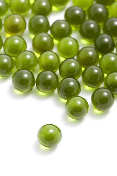 Green capsule pills isolated — Stock Photo, Image