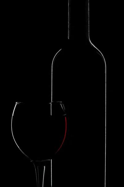 Silhueta de garrafa de vinho e vidro — Fotografia de Stock