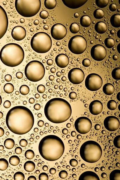 Goldene Wassertropfen Hintergrund — Stockfoto