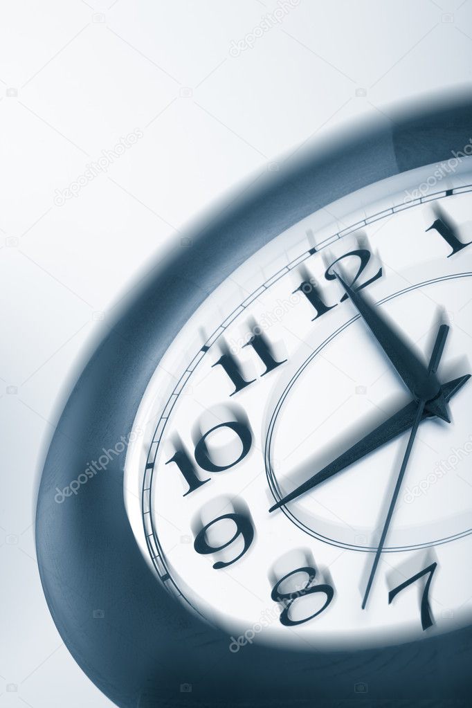 Blue clock shaking. time consept