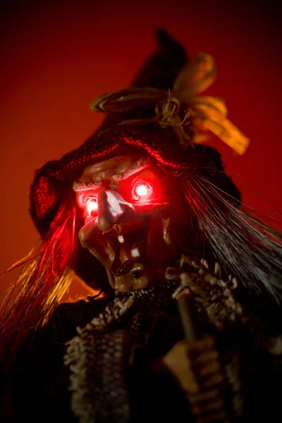 Witch puppet with red glowing eyes — Stock Photo, Image