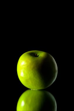 Green apple isolated over black