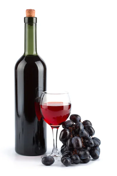 Botol anggur merah, kaca dan anggur — Stok Foto