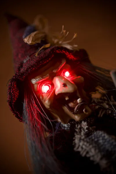 Witch puppet with red glowing eyes — Stock Photo, Image