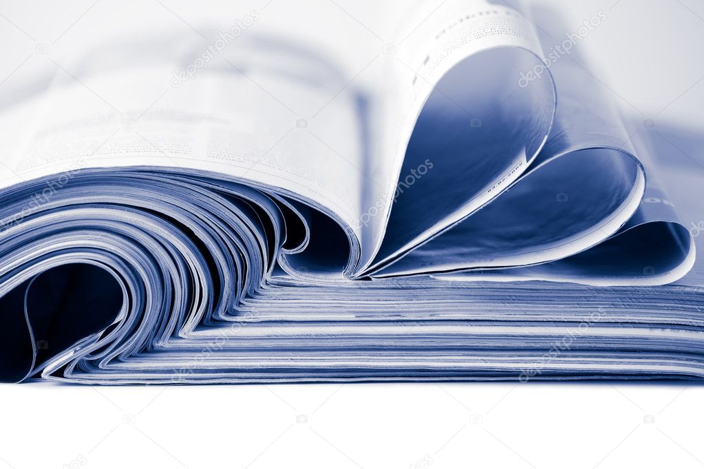 Stack of magazines toned blue isolated