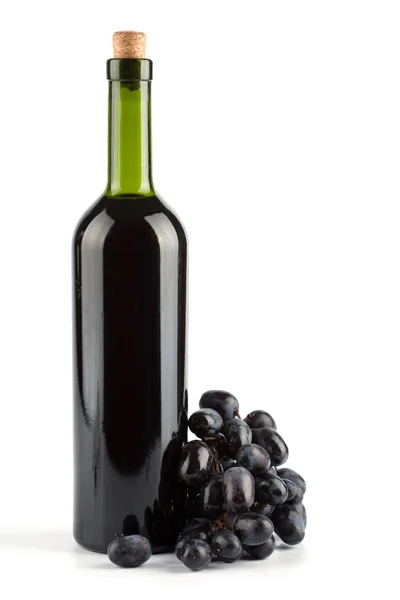 Bottle of wine and grapes isolated — Stock Photo, Image