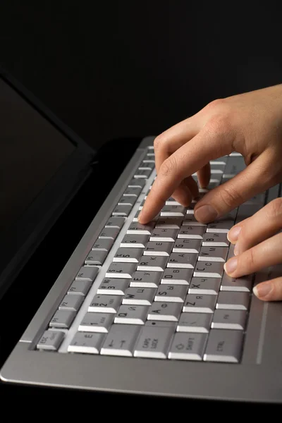 Fingers over notebook keyboard — Stock Photo, Image