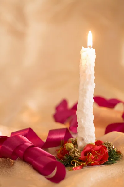 Burning candle and christmas accessories — Stock Photo, Image