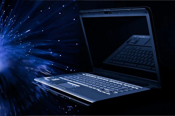 Modern laptop över svart — Stockfoto