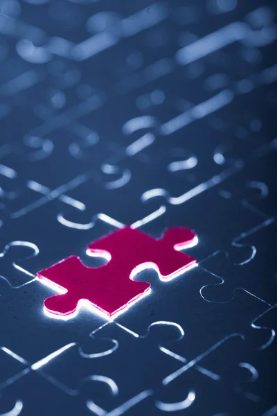 Blue puzzle with one red piece — Stock Photo, Image
