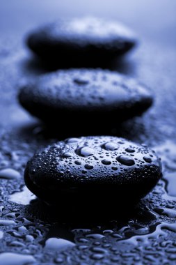 Shiny zen stones with water drops