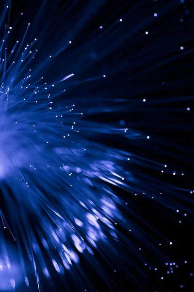 Abstrato fibra óptica azul sobre preto — Fotografia de Stock