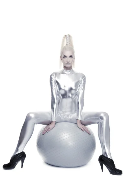 Cyber woman sitting on a silver ball — Stock Photo, Image