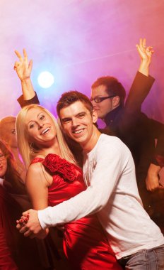 Happy couple in the night club clipart